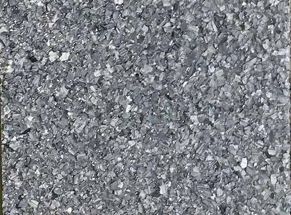 Basalt epoxy flake floor color sample with layered medium-gray, light-gray, and white flakes.
