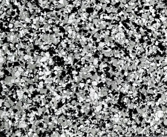 Domino epoxy flake floor color sample with black, white, and gray flakes.