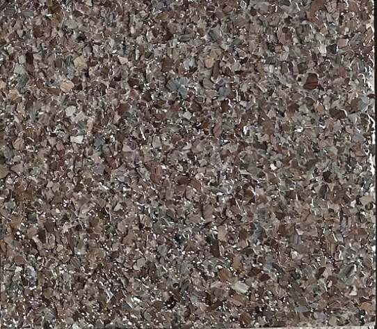 Garnet epoxy flake floor color sample with brown, gray, cream, and muted red-brown flakes.
